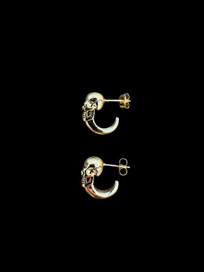 Unisex stainless steel skull earrings with hoop design.