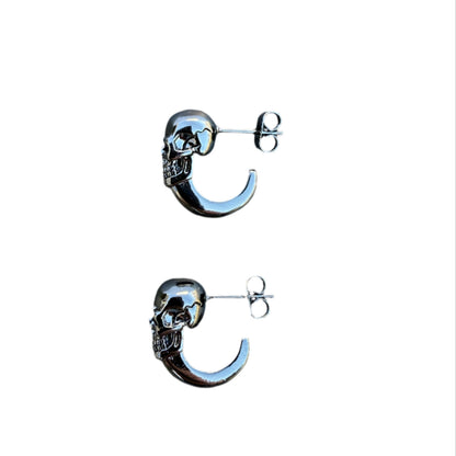Unisex stainless steel skull earrings with hoop design.