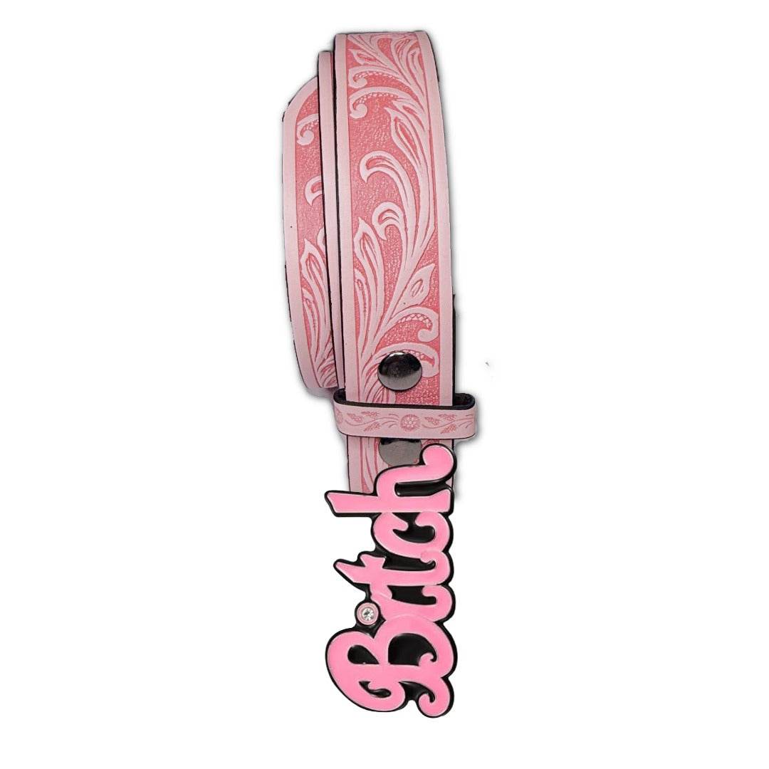 Pink belt with decorative patterns and a bold pink "Bitch" buckle.