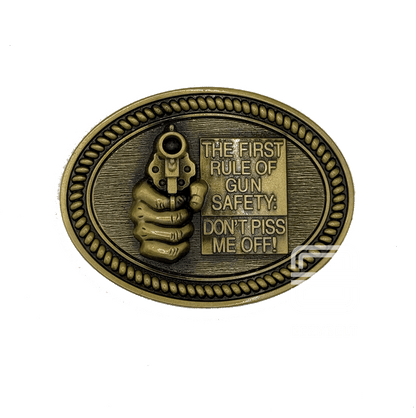 Antique gold-toned Locked & Loaded gun safety belt buckle with raised revolver and bold western-style border.